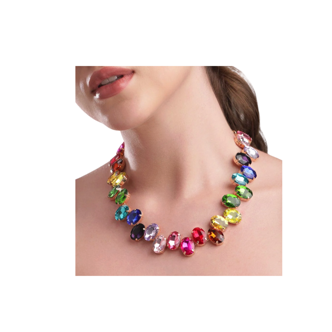 Multicolored gemstone necklace on a model against a white background