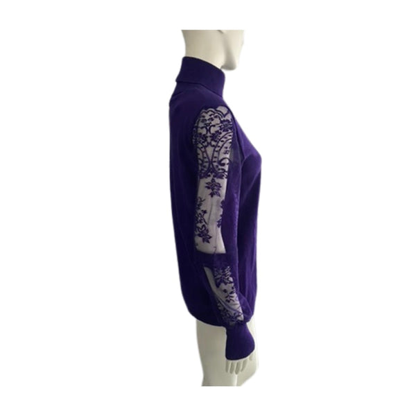 Purple sweater with white lace detailing on a mannequin against a white background