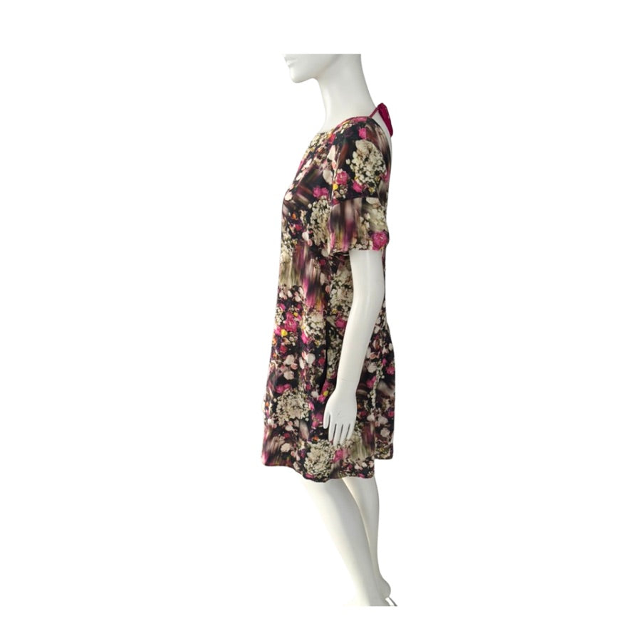 Floral dress on a mannequin against a white background