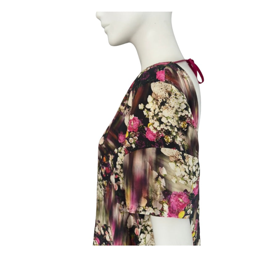 Floral patterned garment on a mannequin against a white background