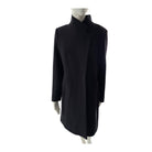 Navy coat on a mannequin against a white background