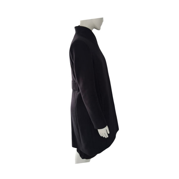 Navy coat on a mannequin against a white background