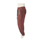 pink jogger pants with sequin embellishments on a white background