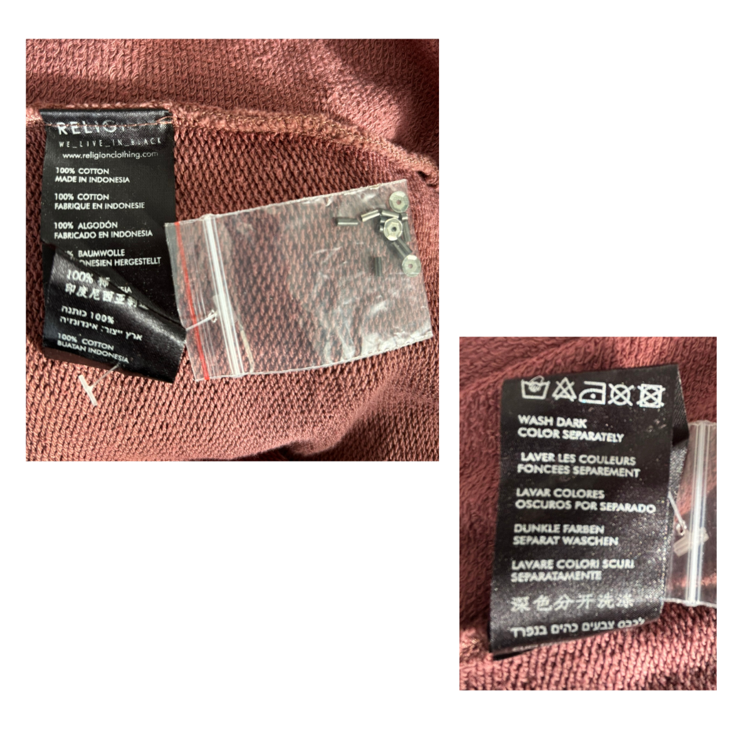 Close-up of clothing labels and tags on a fabric background