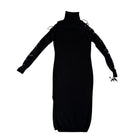 Black dress with long sleeves and lace-up details on a white background