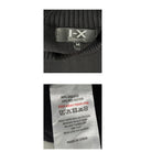 Close-up of a clothing label with 'FX London' branding and fabric composition details.