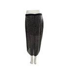 Black fishnet skirt on a mannequin against a white background