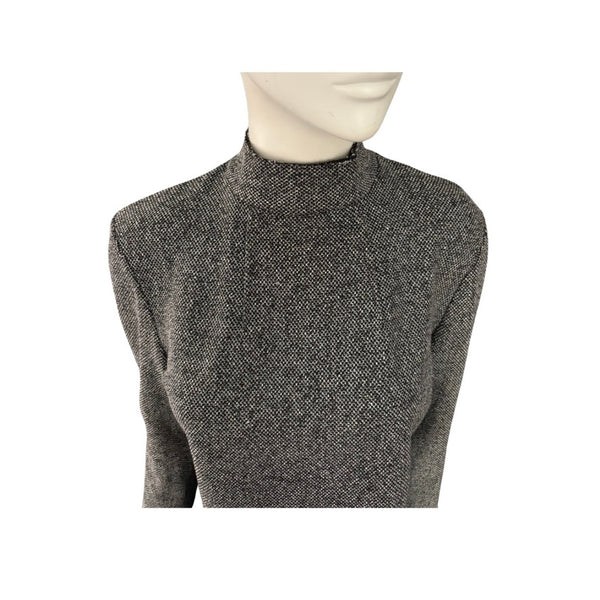 Grey textured sweater on a mannequin against a white background