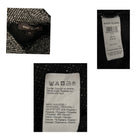 Close-up of River Island label on a textured fabric background