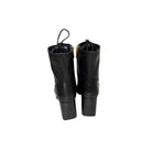 Pair of black leather boots on a white background