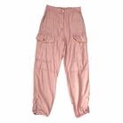 Pink cargo pants on a white background