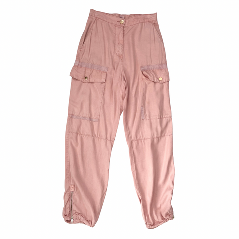 Pink cargo pants on a white background