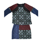 Multicolored patterned dress with long sleeves on a white background