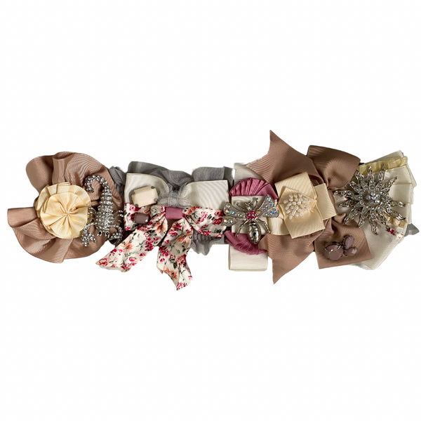 A preloved multicolored floral belt with rosettes and brooches, featuring cream, pink, beige, and green tones, with silver-tone hardware.