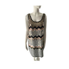 Mannequin wearing a sleeveless dress with a black and white zigzag pattern on a white background