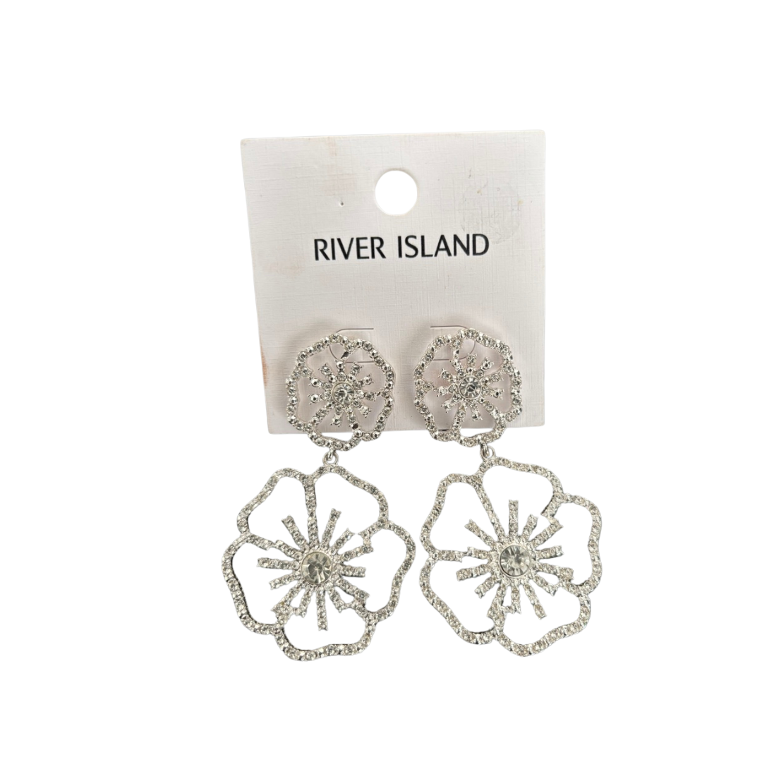 Silver floral earrings on a River Island branded card against a white background
