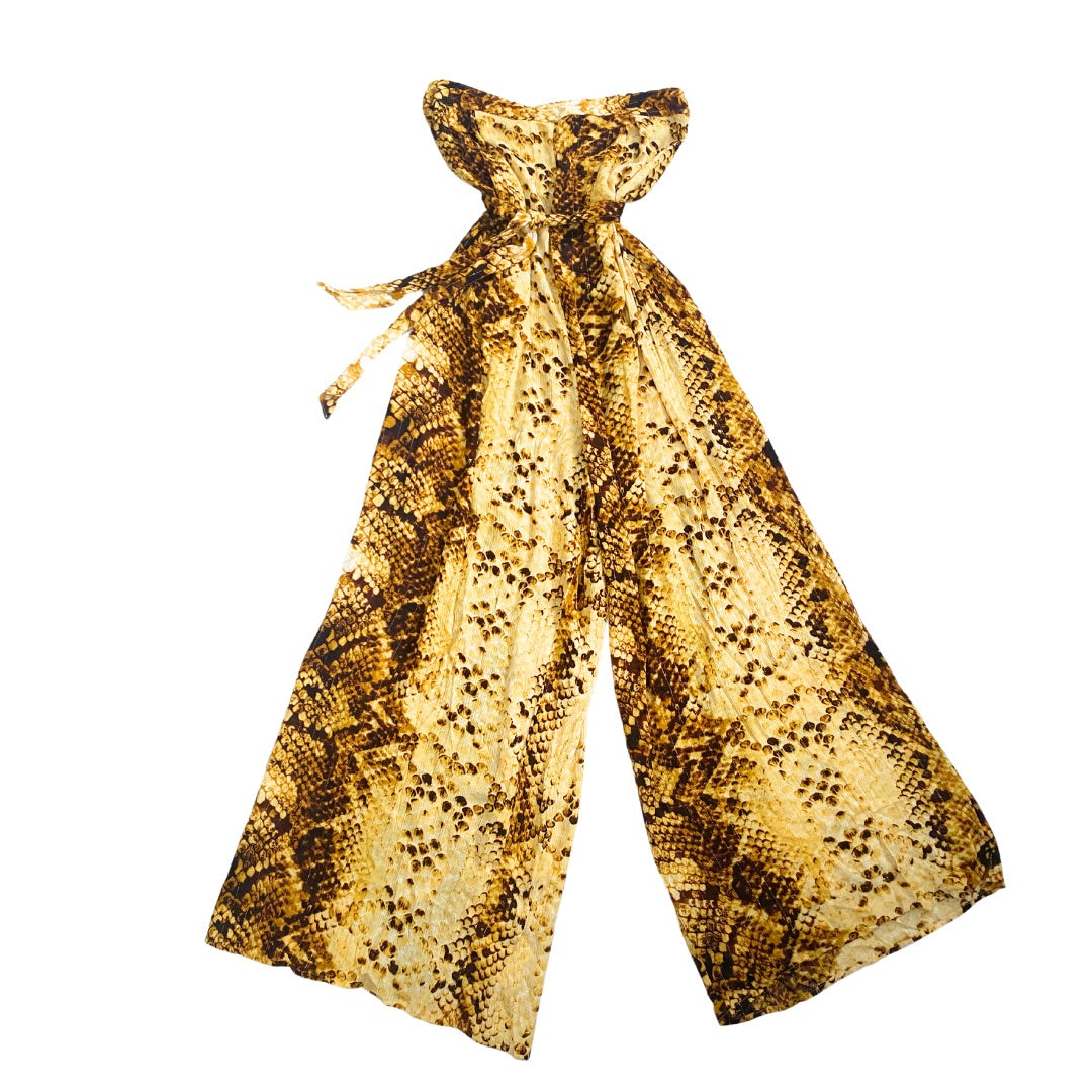 A strapless jumpsuit with a snakeskin print in yellow, brown, and gold, featuring a tie-back strap and wide leg design.