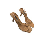 Tan high-heeled shoes with 'Sensuo' branding on a white background