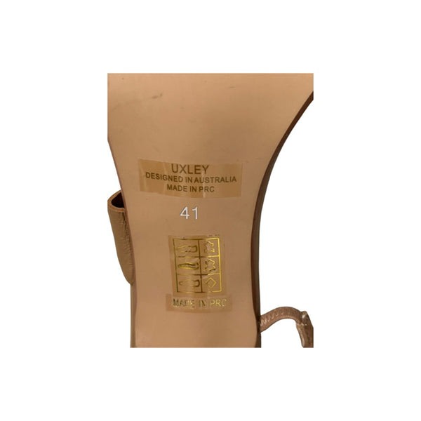 Brown shoe with 'Uxley' branding and size marking on a white background