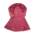 Pink dress with long sleeves on a white background