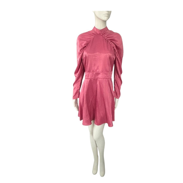 Pink dress on a mannequin against a white background