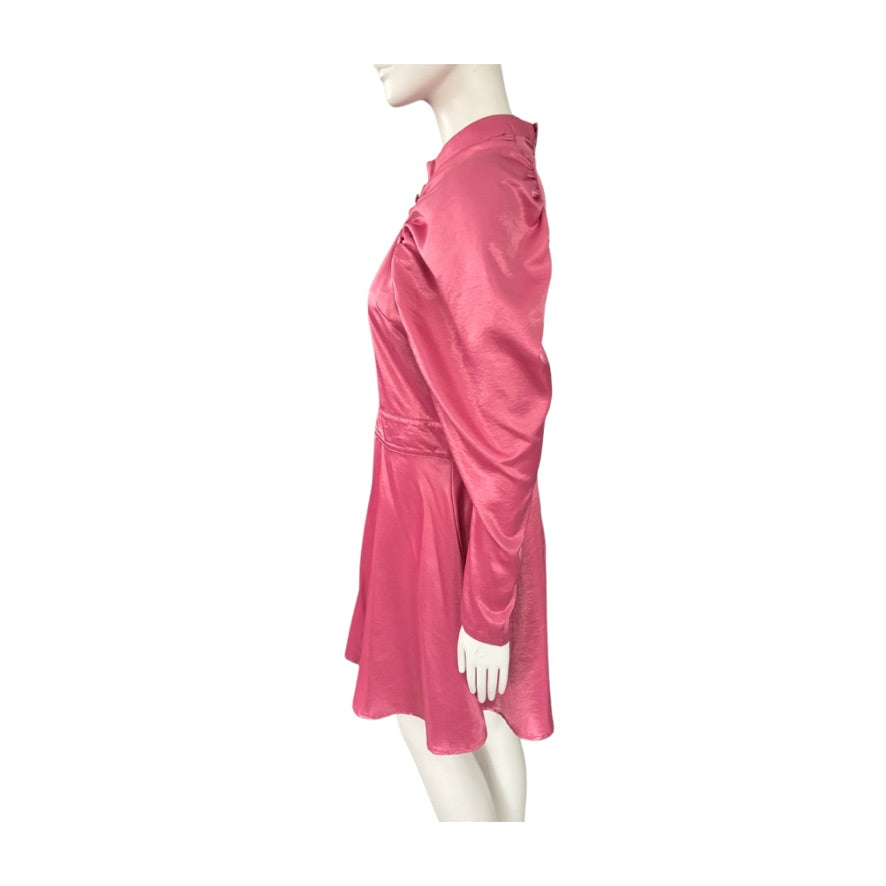 Mannequin wearing a pink dress on a white background