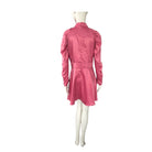 Mannequin wearing a pink dress on a white background
