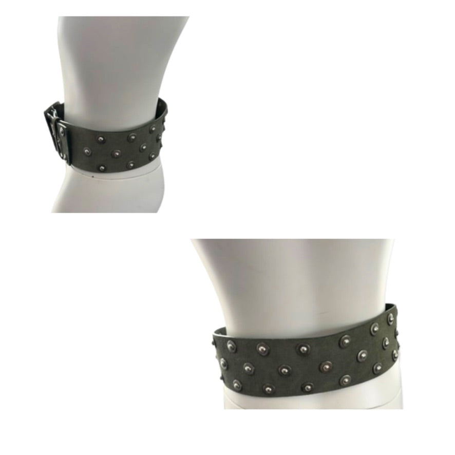 Green studded belt on mannequin against a white background