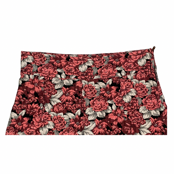 Floral-patterned bag with coral and beige flowers on a white background