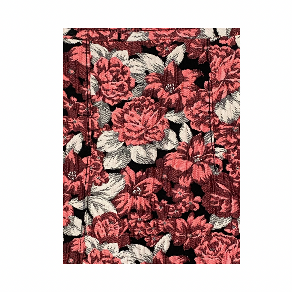 Floral patterned fabric with coral, cream, and black colors on a white background