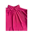Pink blouse with a collar and decorative elements on a white background