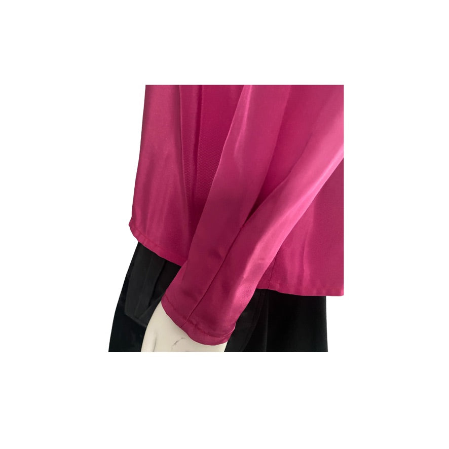 Close-up of a bright pink long-sleeve shirt on a white background