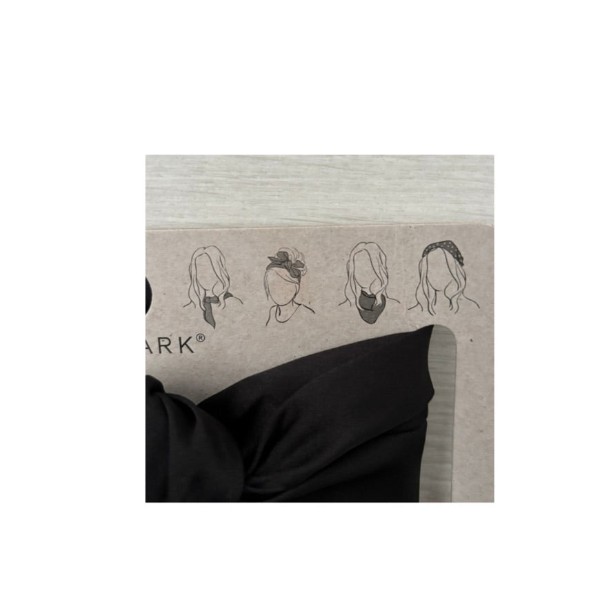Hair styling chart with illustrations of hairstyles on a cardboard background