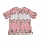 Pink top with silver embroidery on a white background