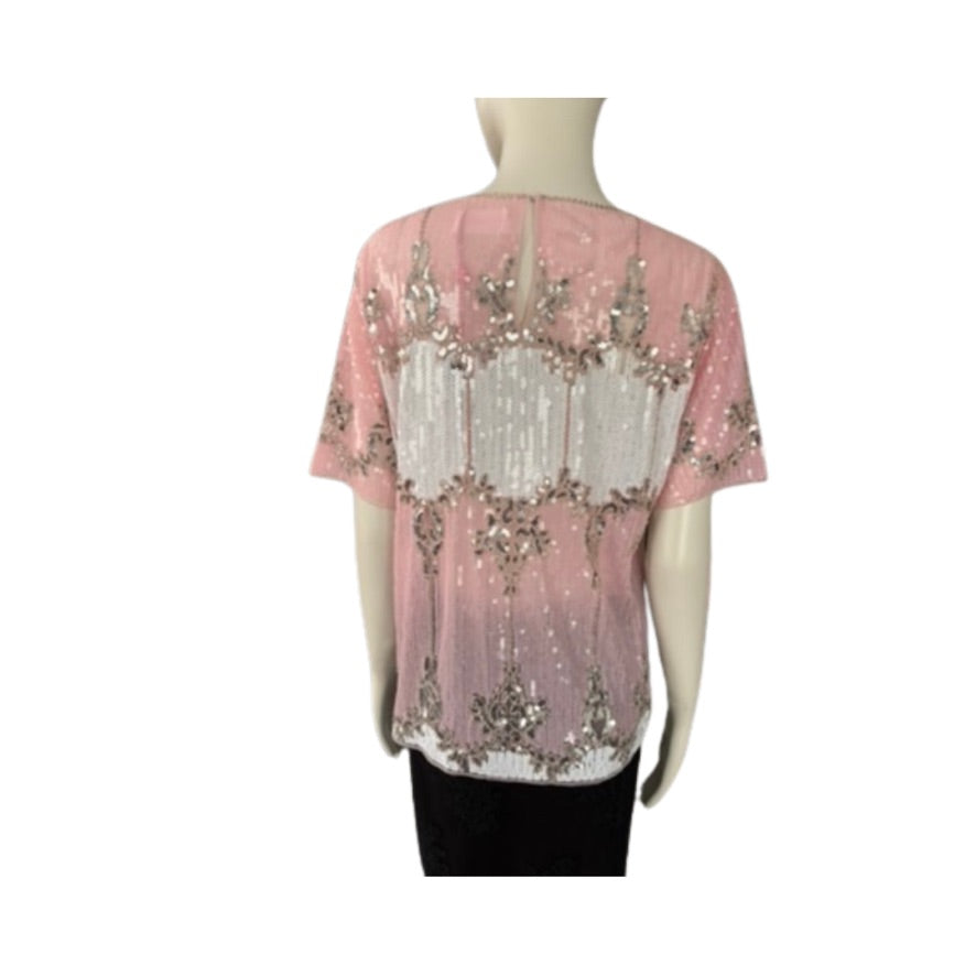 Pink top with sequin embroidery on a mannequin against a white background
