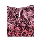 Pink sequin fabric on a white background