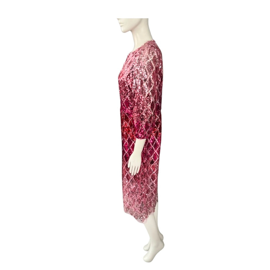 Mannequin wearing a pink lace dress on a white background