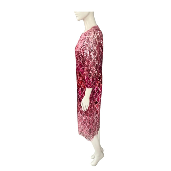Mannequin wearing a pink lace dress on a white background