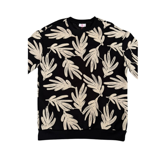 Black sweatshirt with beige leaf pattern on a white background