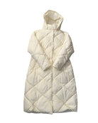 Cream quilted puffer vest on a white background
