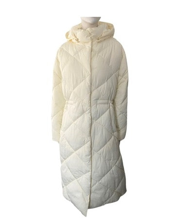 Cream quilted puffer coat on a mannequin against a white background