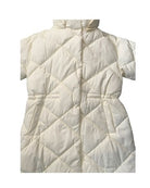 Cream quilted coat close-up on a white background