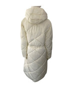 Cream quilted jacket with a hood on a white background