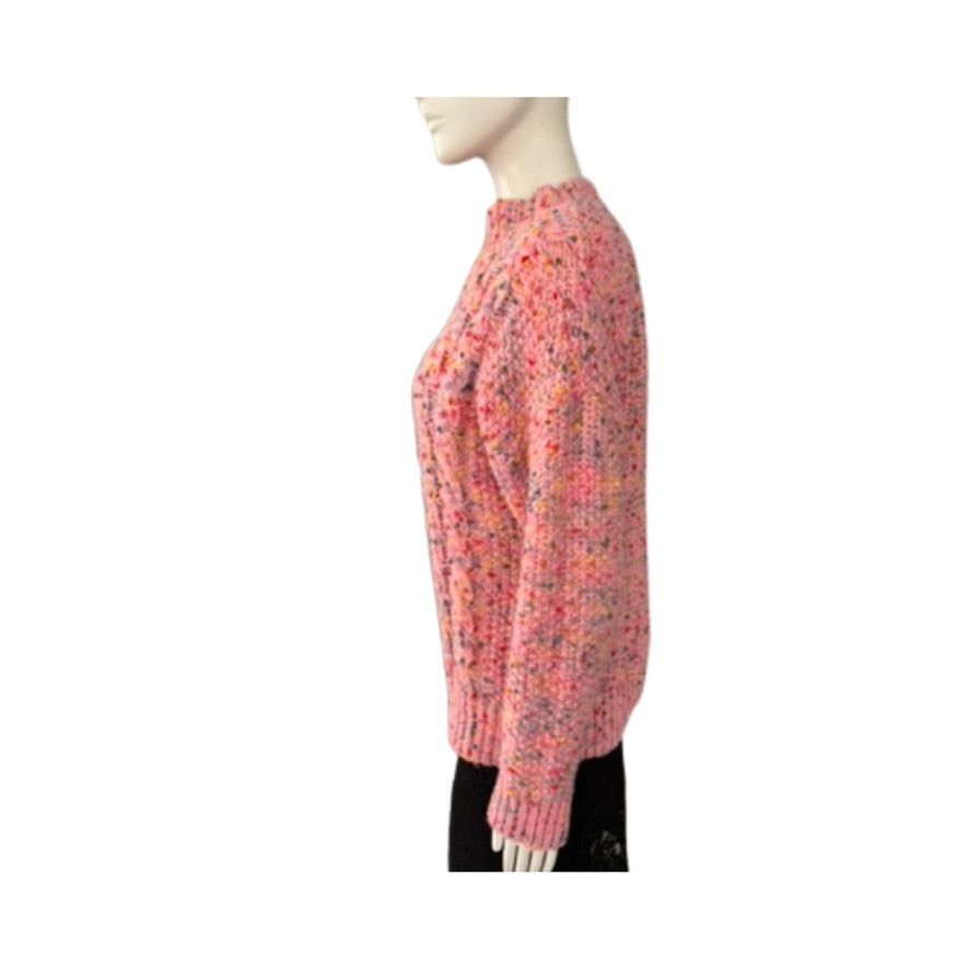 Mannequin wearing a pink chunky knit sweater on a white background