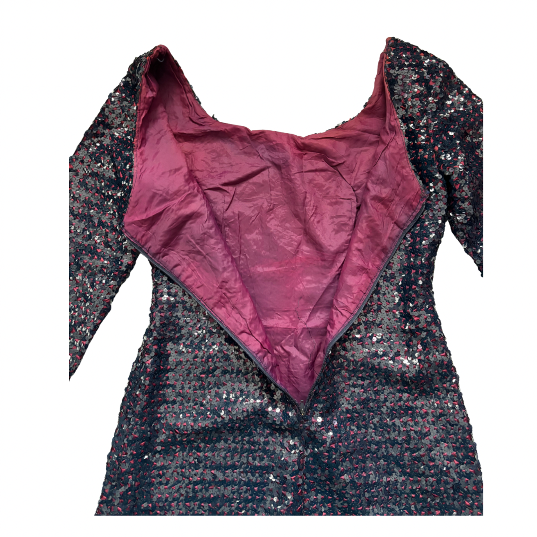 Burgundy sequin dress with a magenta inner lining on a white background