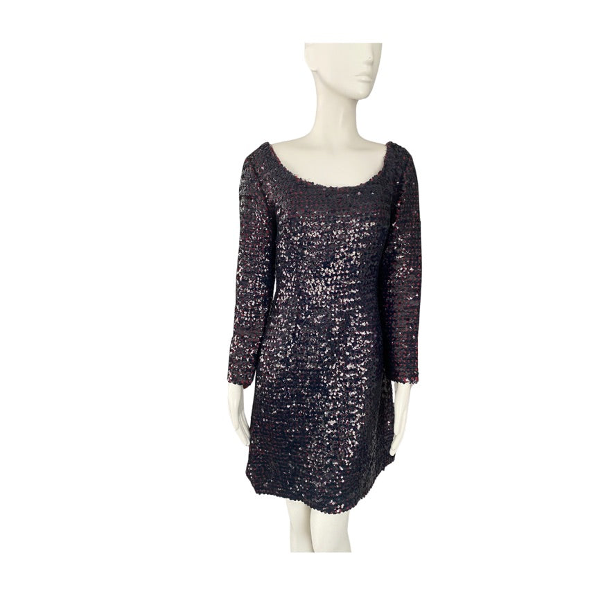 Mannequin wearing a dark sequined dress on a white background