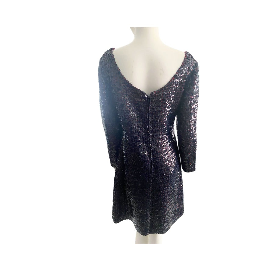 Burgundy sequin top on a mannequin against a white background