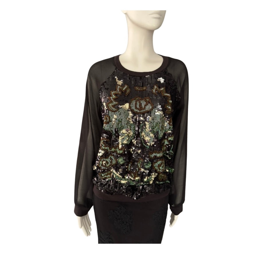 Black sequin top on a mannequin against a white background