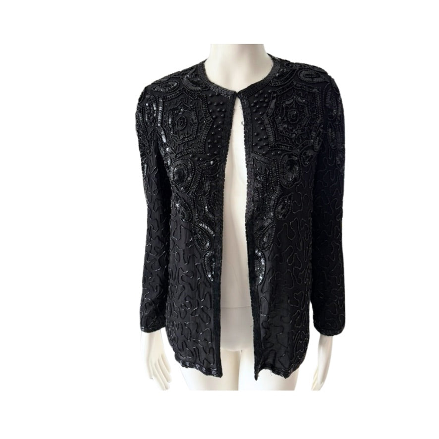 Black beaded jacket on a mannequin against a white background