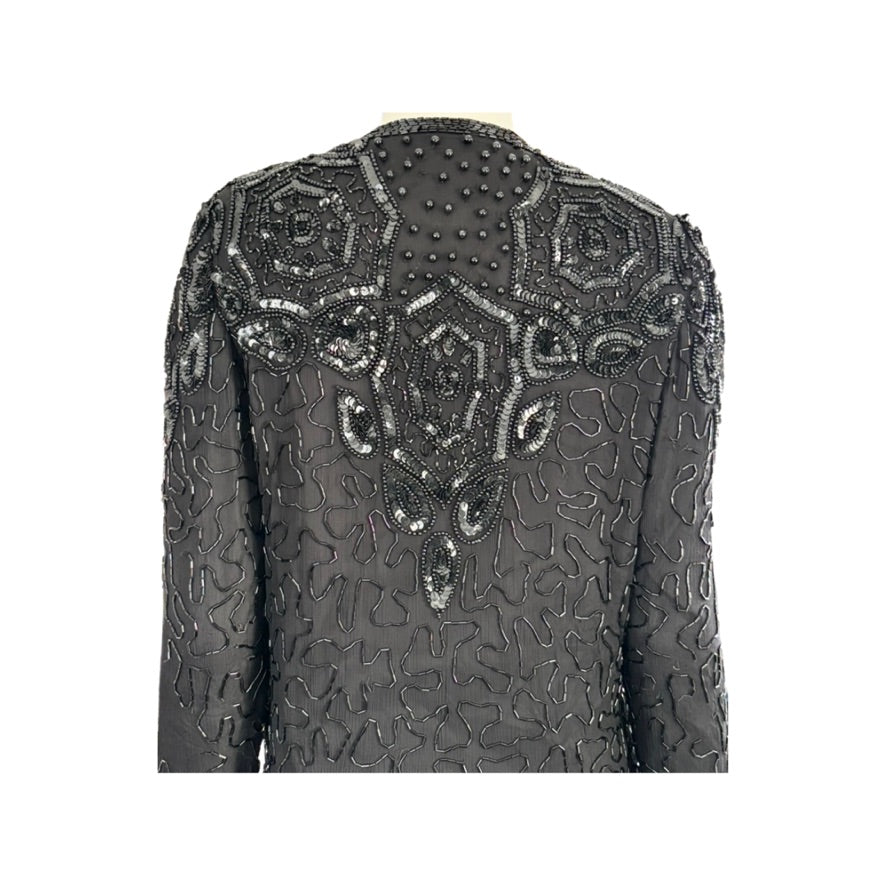 Black beaded jacket on a white background